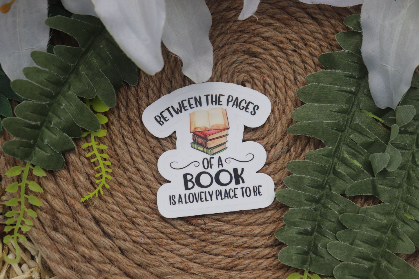 Between the pages of a book is a lovely place to be sticker