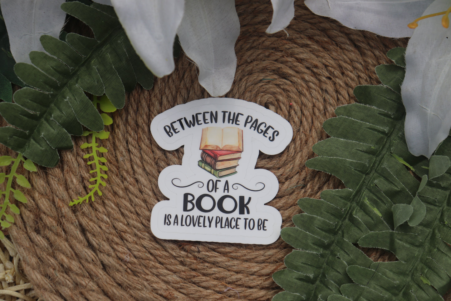 Between the pages of a book is a lovely place to be sticker